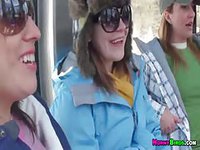 Amateur exhibitionist exposes her natural breasts on ski lift during skiing trip with group of horny birds