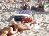 Blonde sucks a lifeguard's cock at the beach