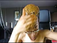 Man pouring shit on his hair