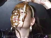 Brunette showering herself with shit