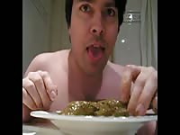 Man eating a plate full of shit